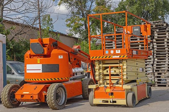 forklift carrying pallets in warehouse in Kenansville